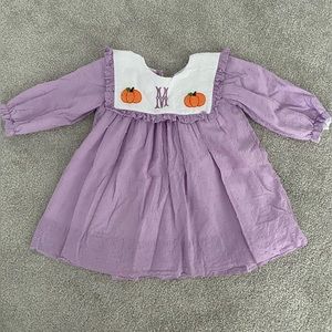 Pumpkin dress with “M” monogram initial